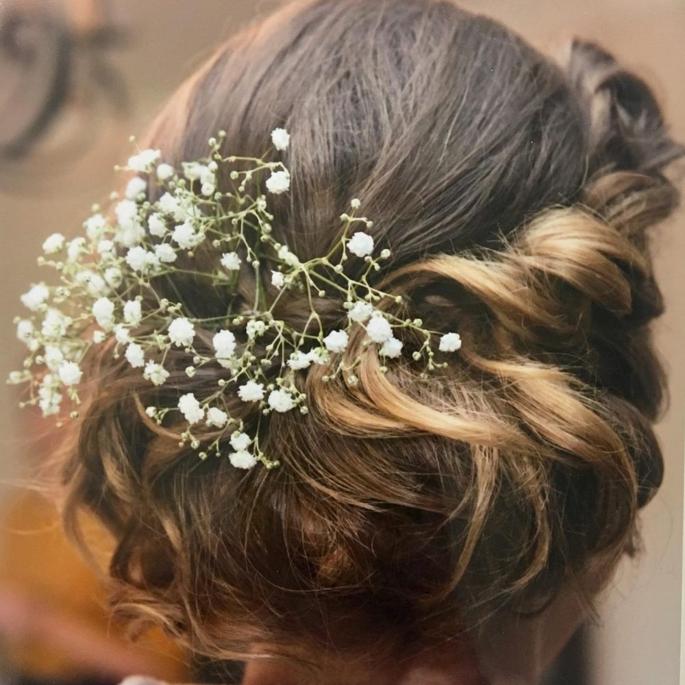 Beautiful Woman Posing with White Flowers in Her Hair  Free Stock Photo