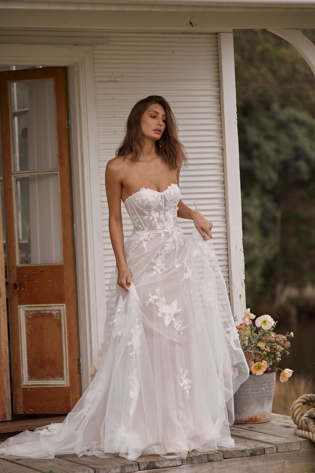 This image shows the Carrie wedding dress by Madi Lane which relates to the wedding dress trends such as bodice corsets