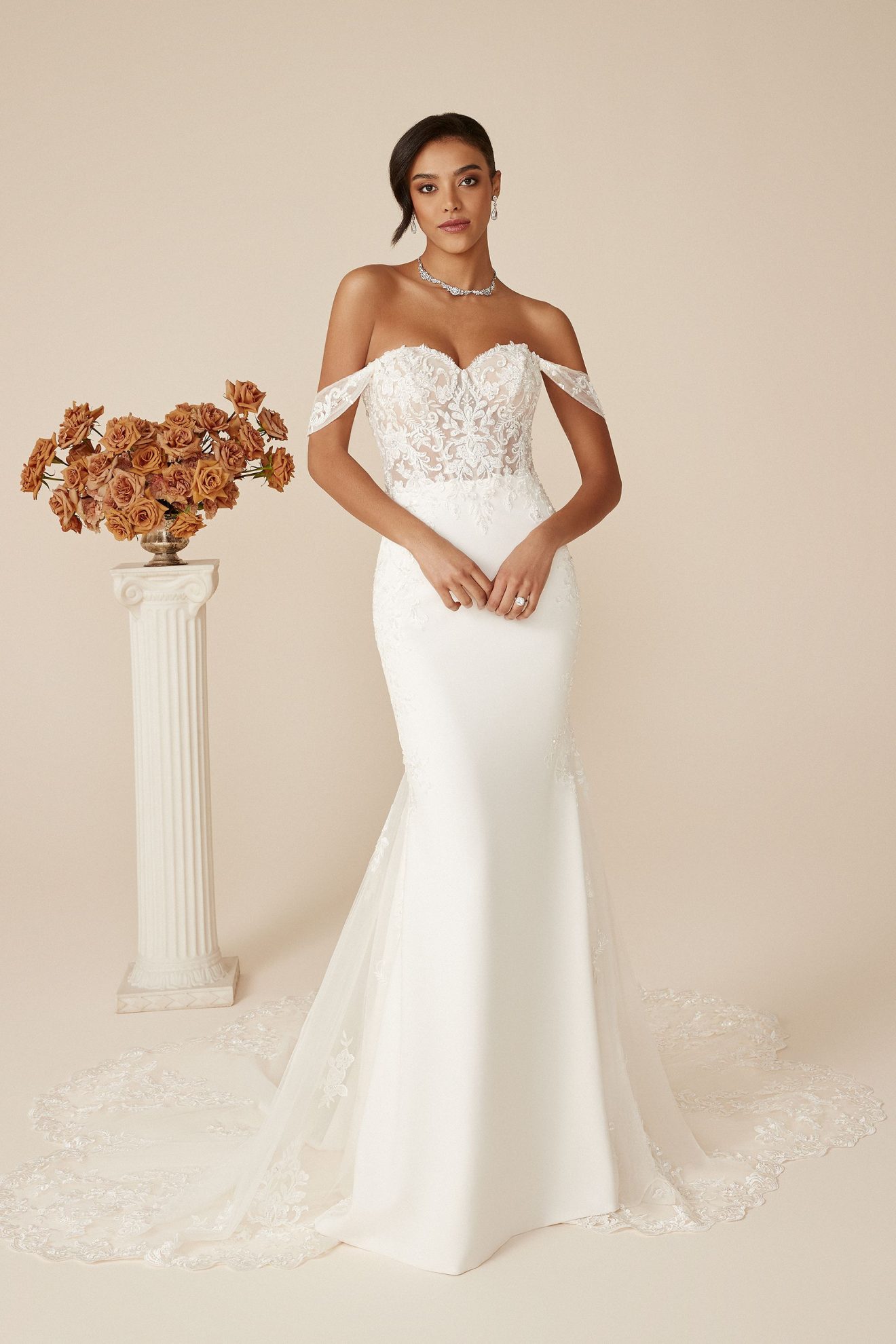 This image shows the Daria wedding dress by Justin Alexander and relates to wedding dress trends such as off-the-shoulder necklines