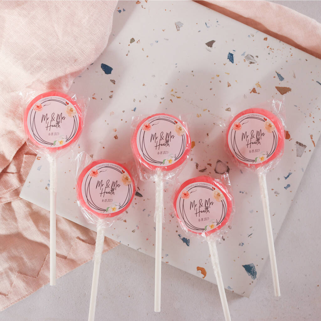 This image shows 5 personalised lollipops that would make the perfect wedding favour.