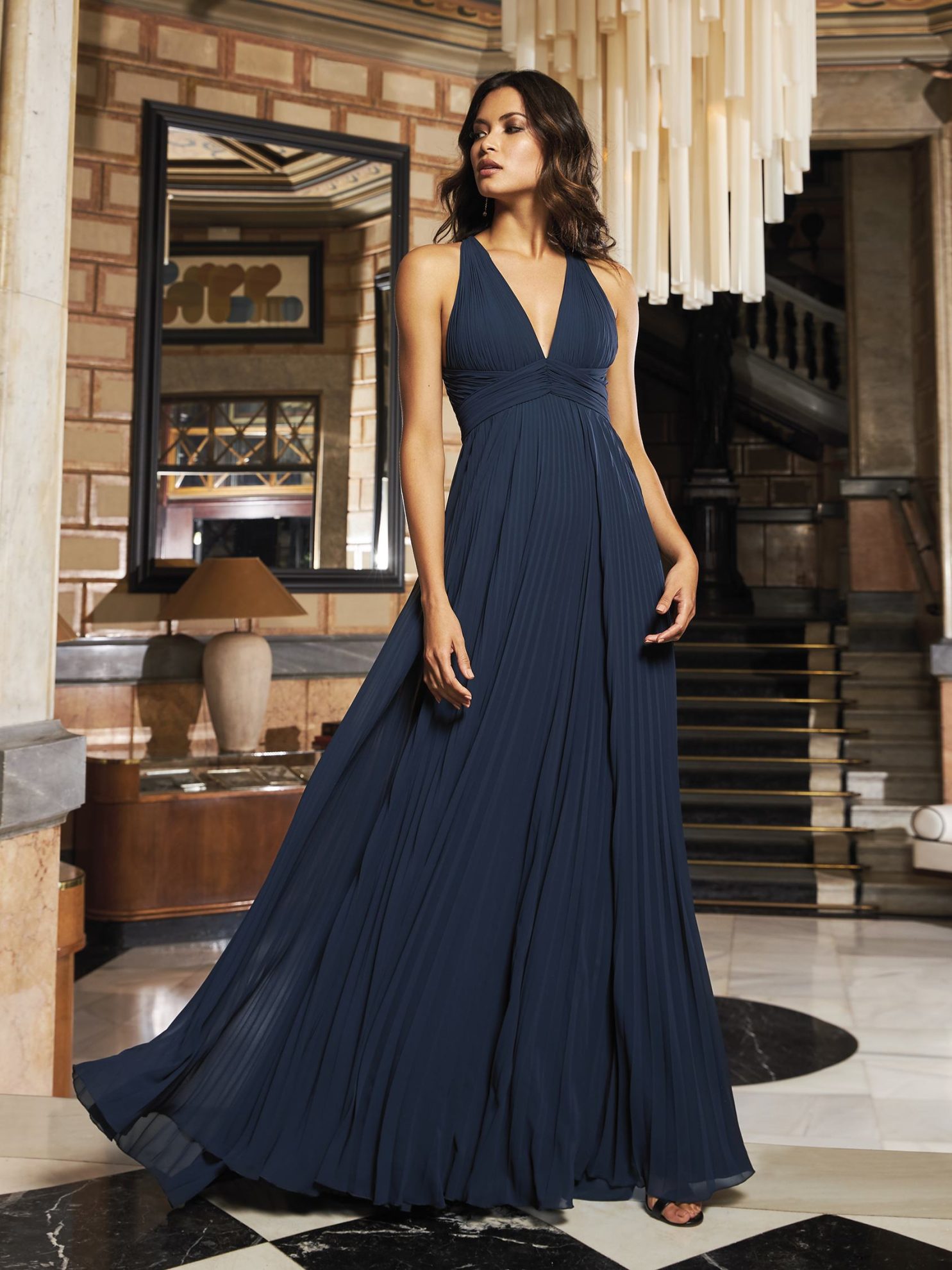A navy bridesmaid dress from Pronovias. Image used in the 8 Unique Something Blue Ideas For Your Wedding Day article.