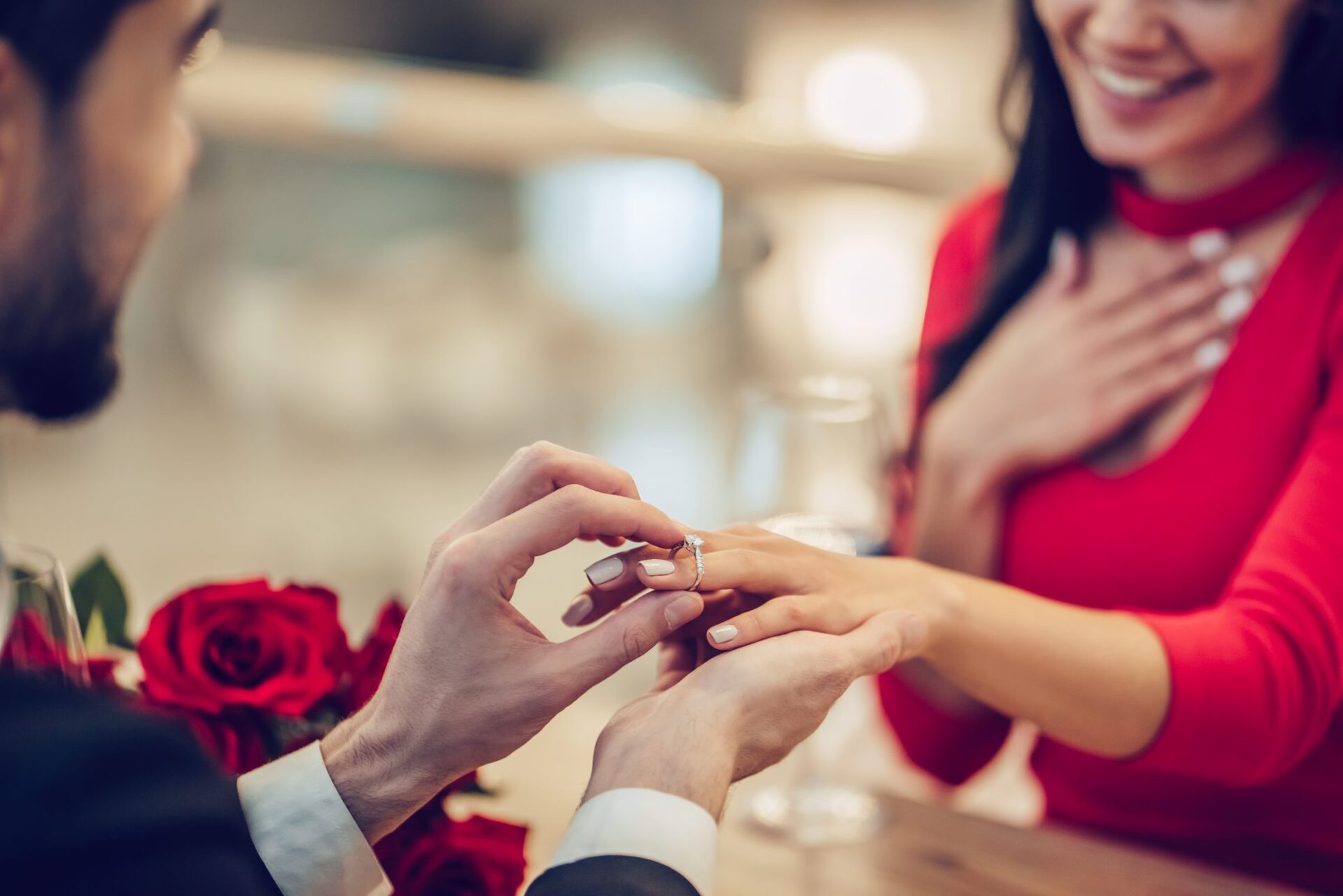 Close up of a man proposing to the woman.