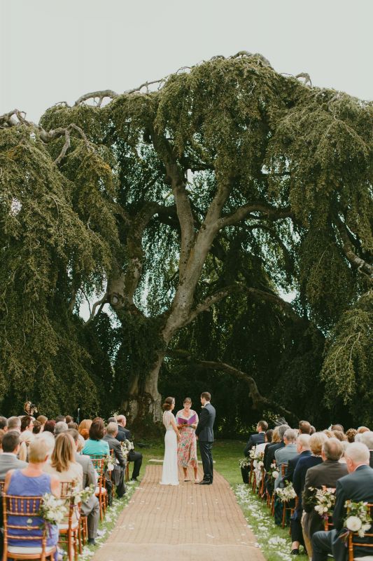 Bride and groom at the top of the aisle in Bellinter House. Image used in the Stunning Outdoor Wedding Venues In Ireland for Spring / Summer article.