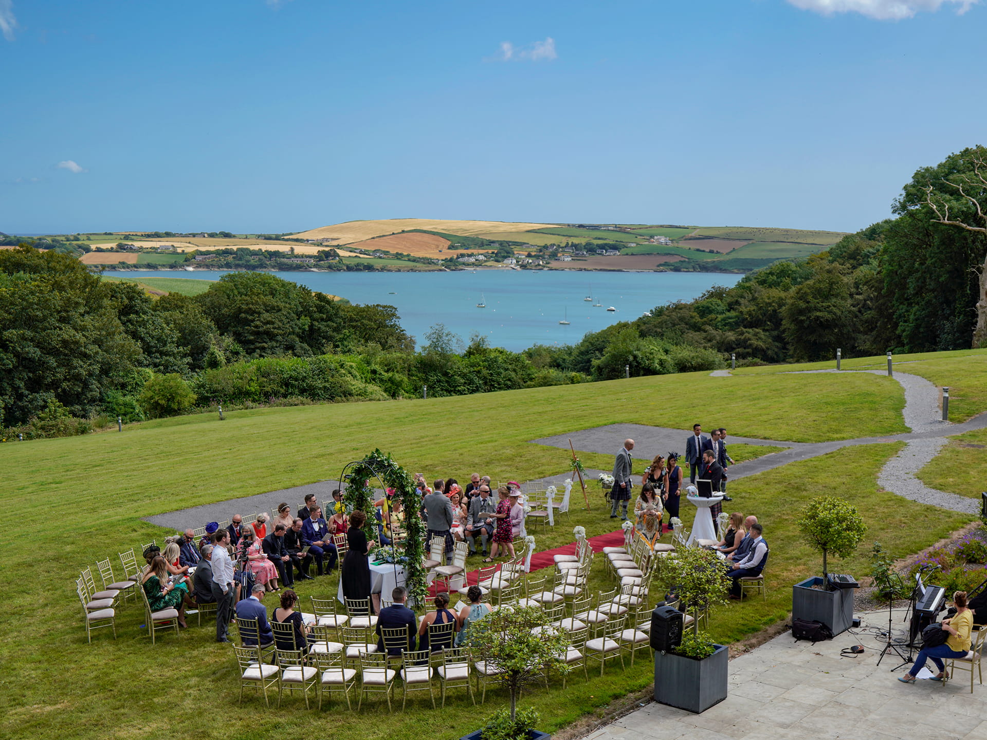An overview of outdoor wedding overlooking Oysterhaven Bay.