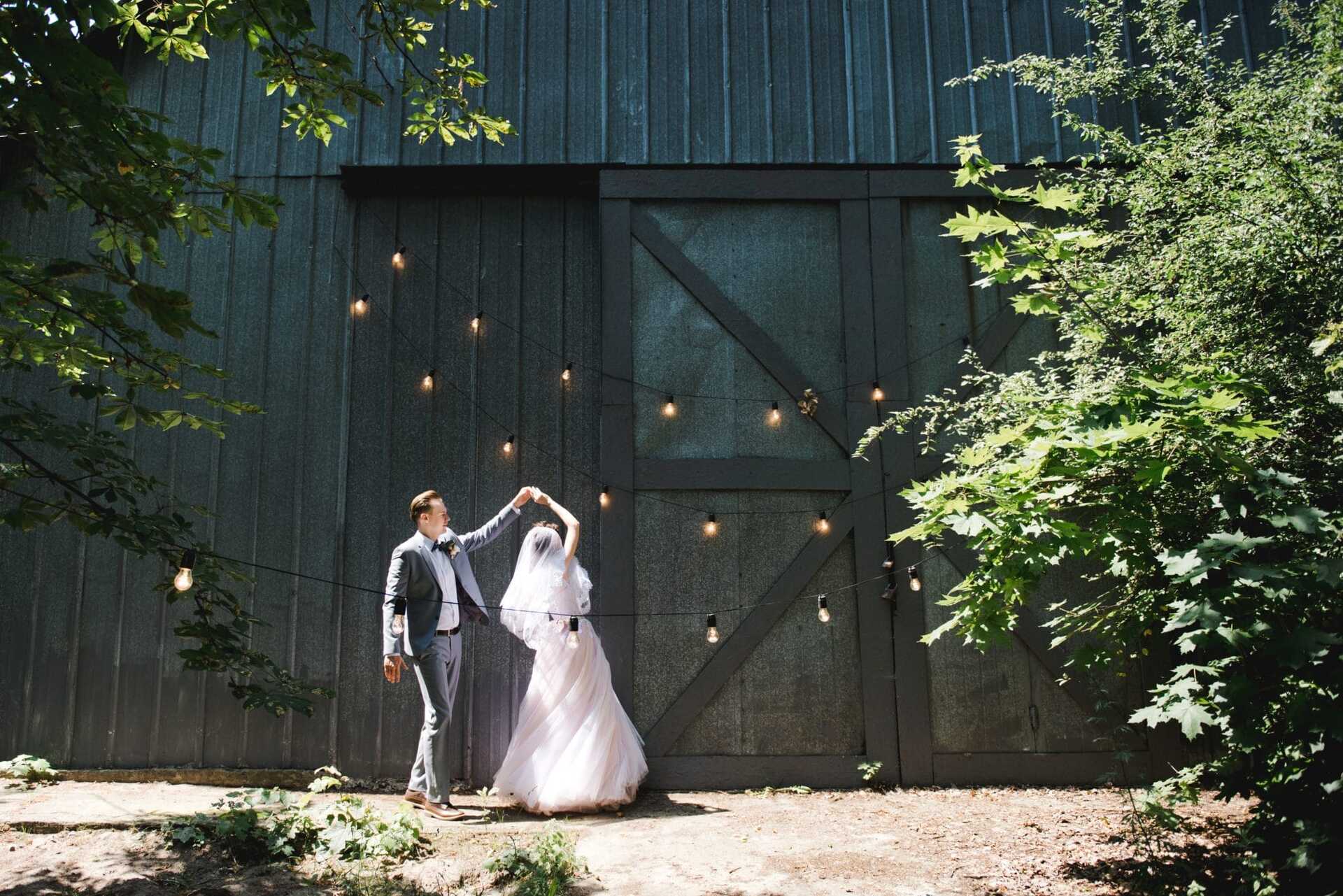 Bride and groom dancing outside. Image used in the 33 Of The Best First Dance Wedding Songs article