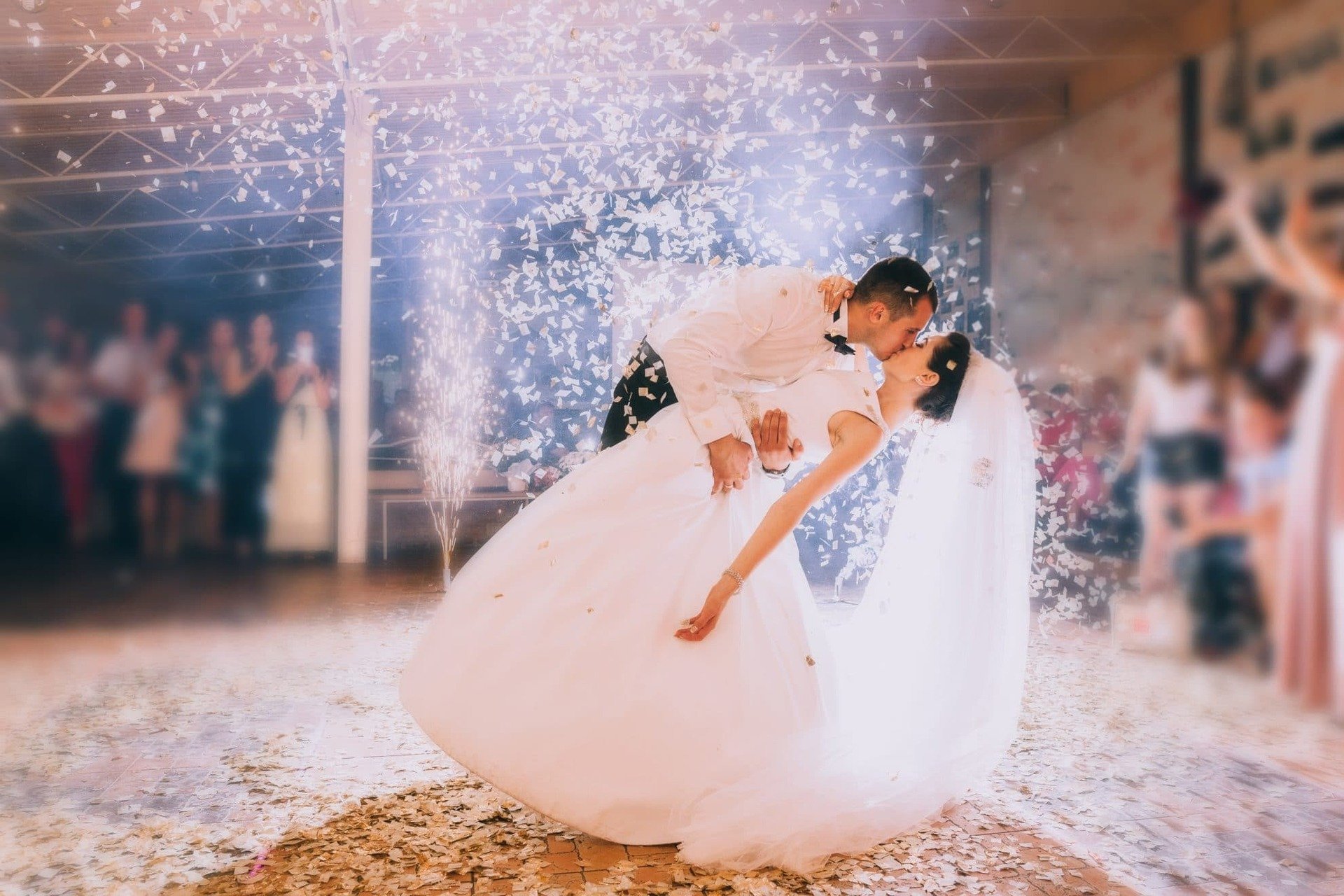 Bride and groom kiss during their first dance.