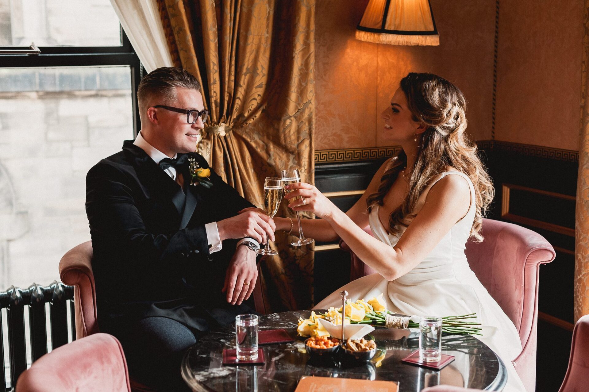 Jordan Humphries & ben Arnold toasting with a glass of Champagne