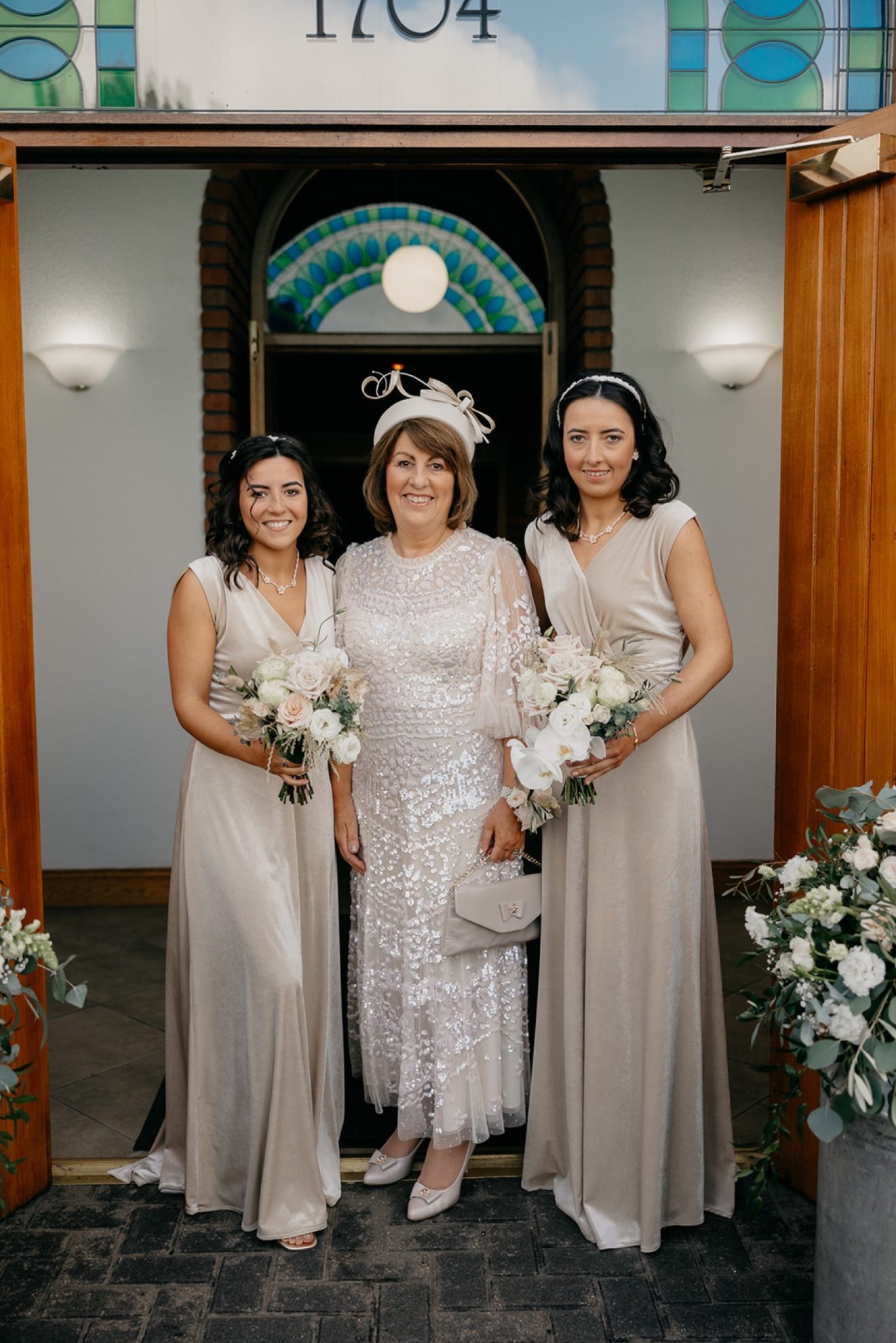 Joanne's mum with her bridesmaids at the church before the ceremony