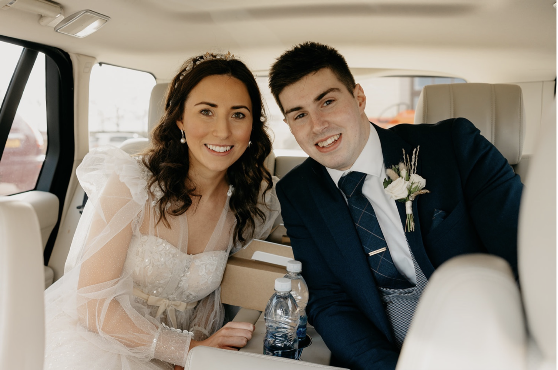 Joanne & Ian in their wedding car from Champagne Moments