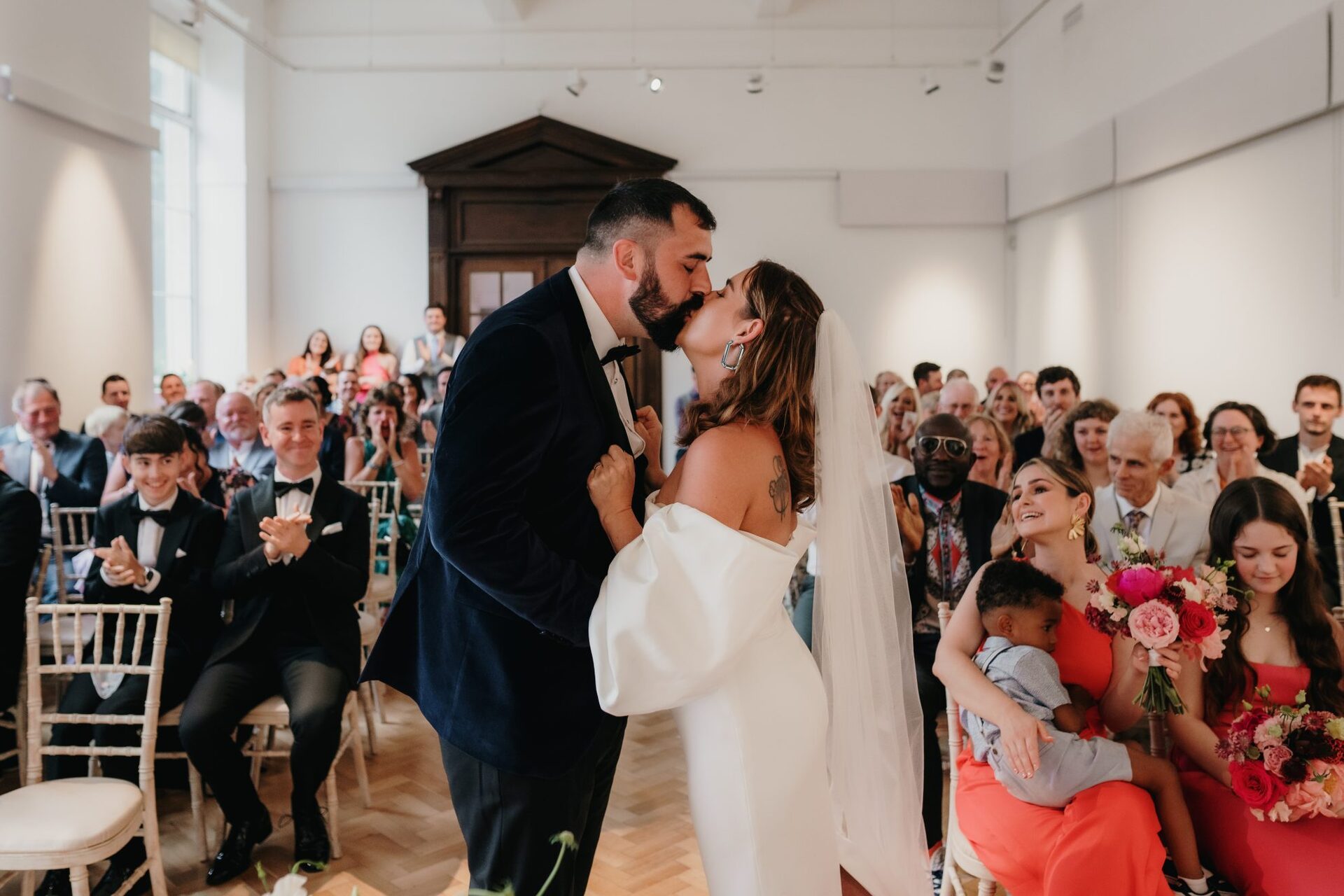 Jael and Greg's wedding ceremony - kissing the bride