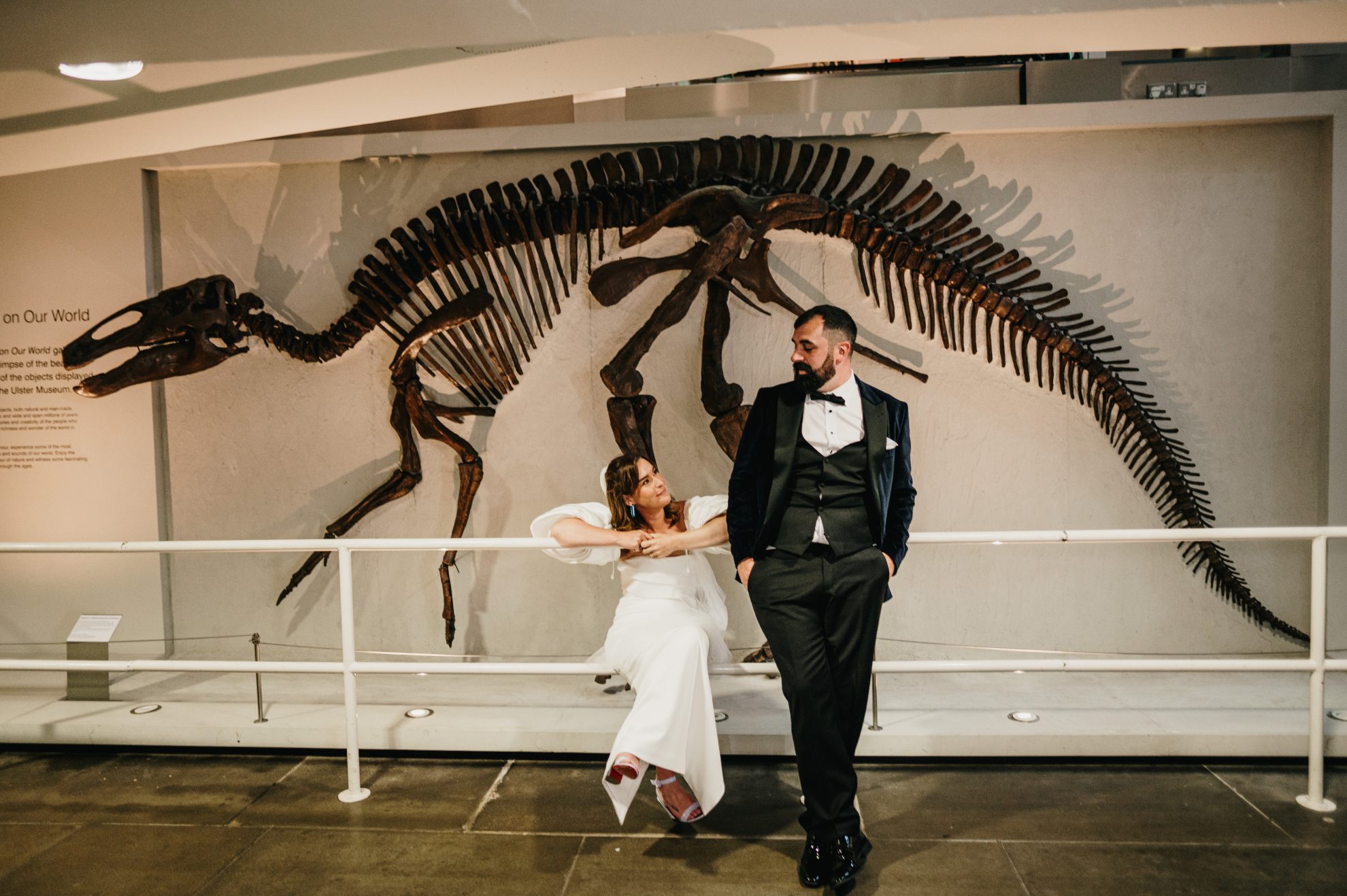 The newlweds in the ulste rmseum belfast with dinosaur