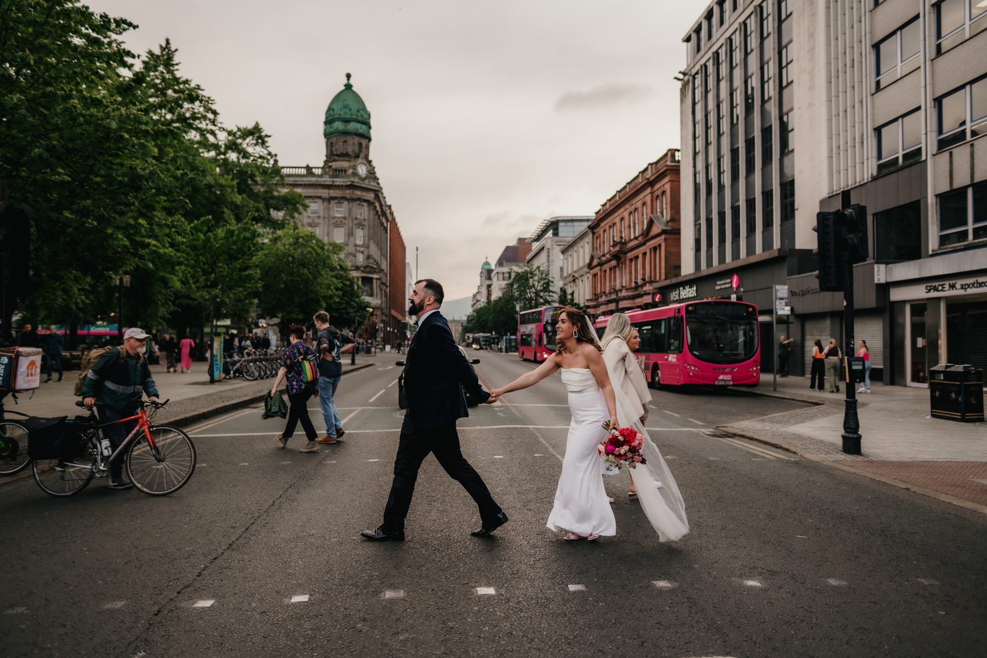 Jael and Greg in Belfast city centre in their wedding attire