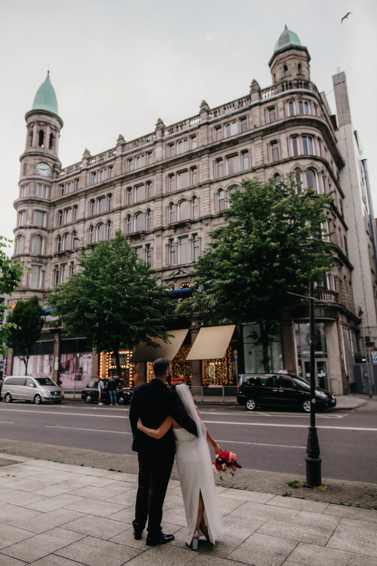 Jael and Greg embracing each other on their wedding day in Belfast City Centre
