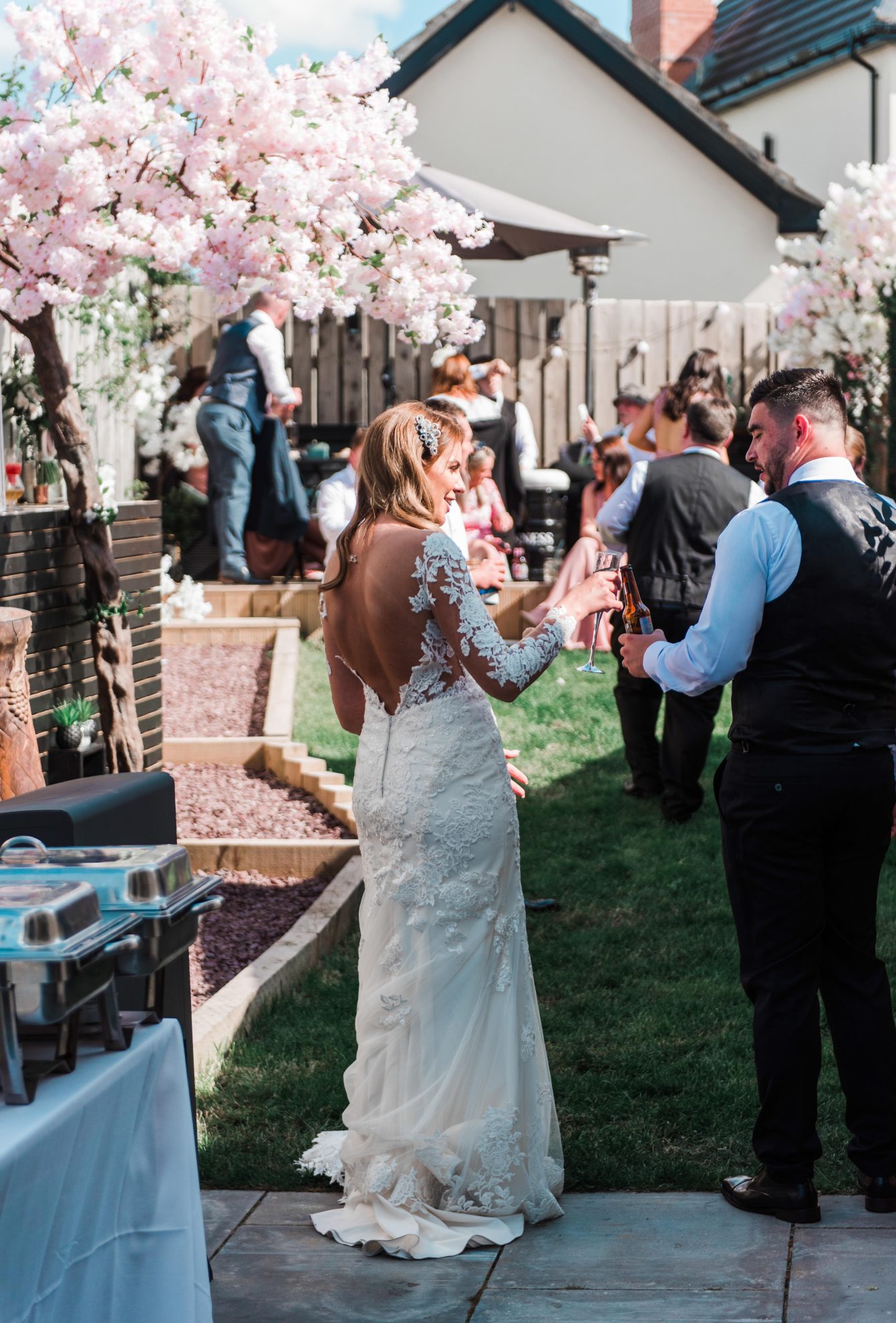 Seidy 7 Matthew celebrating with their friends and family at their garden wedding reception