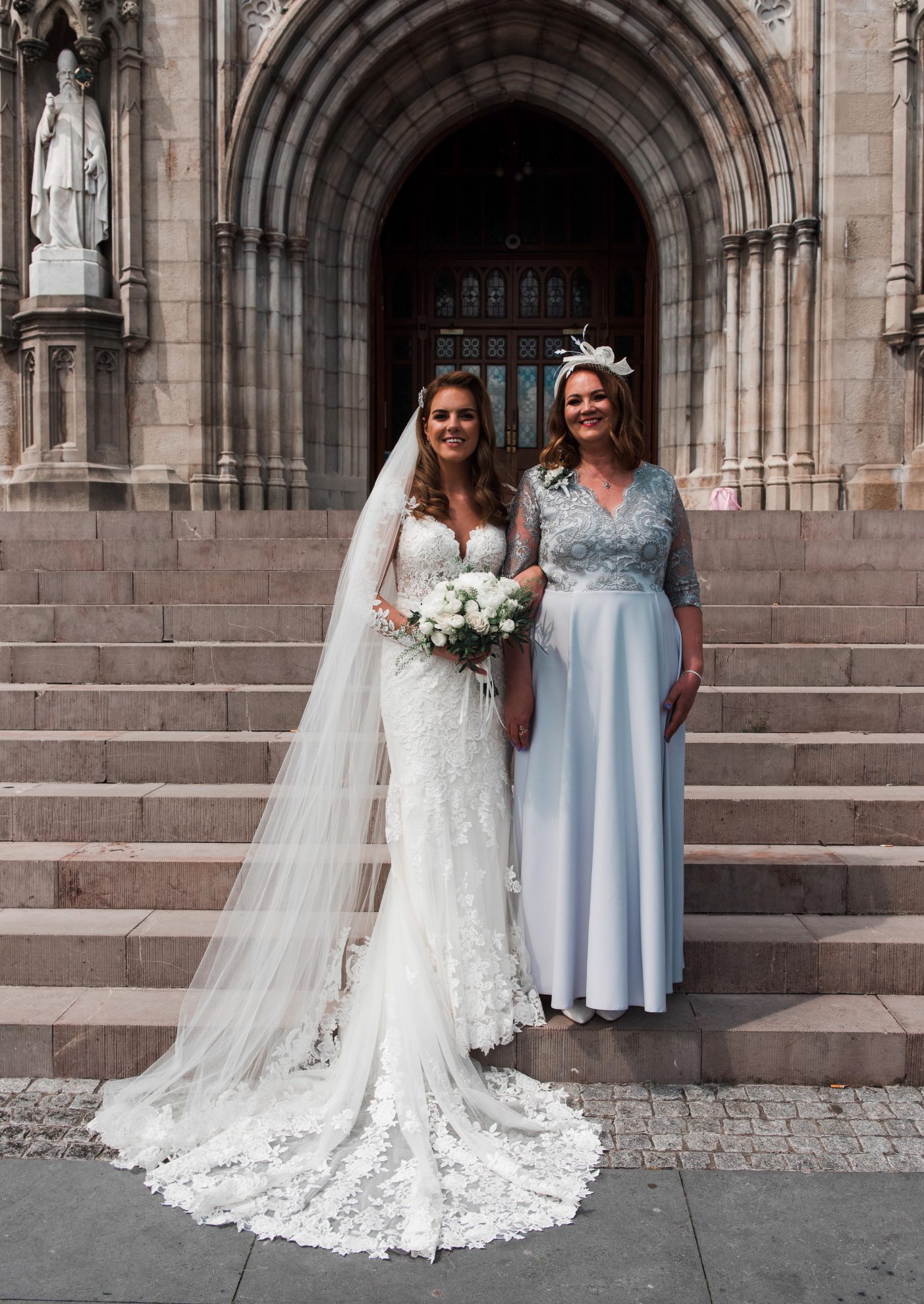 Seidy and her mum on the steps of the church