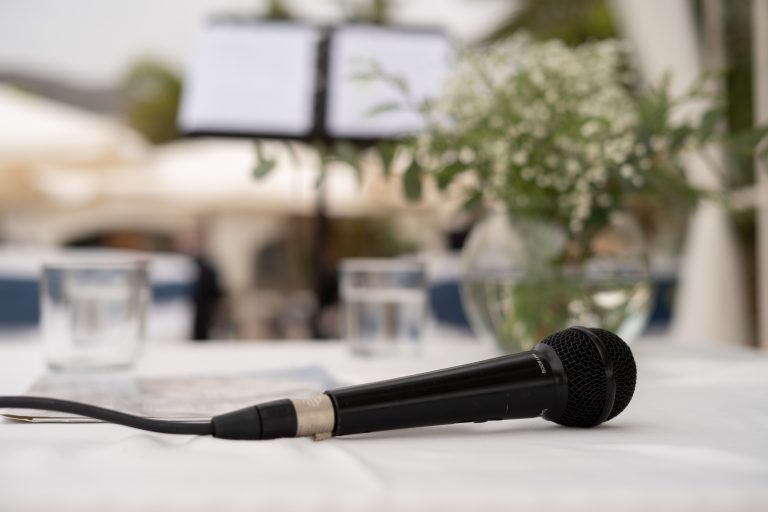 microphone sitting on table at wedding reception for wedding speeches
