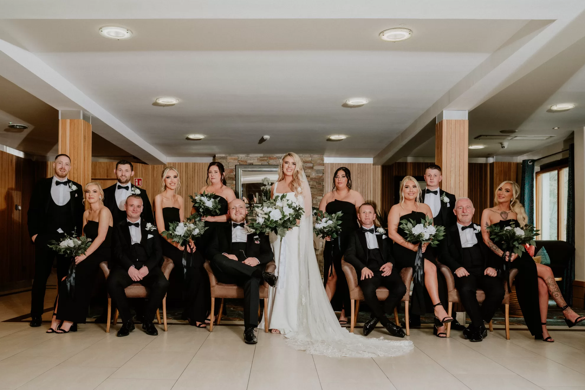 Nicola and Leonard with their groomsmen and bridesmaids