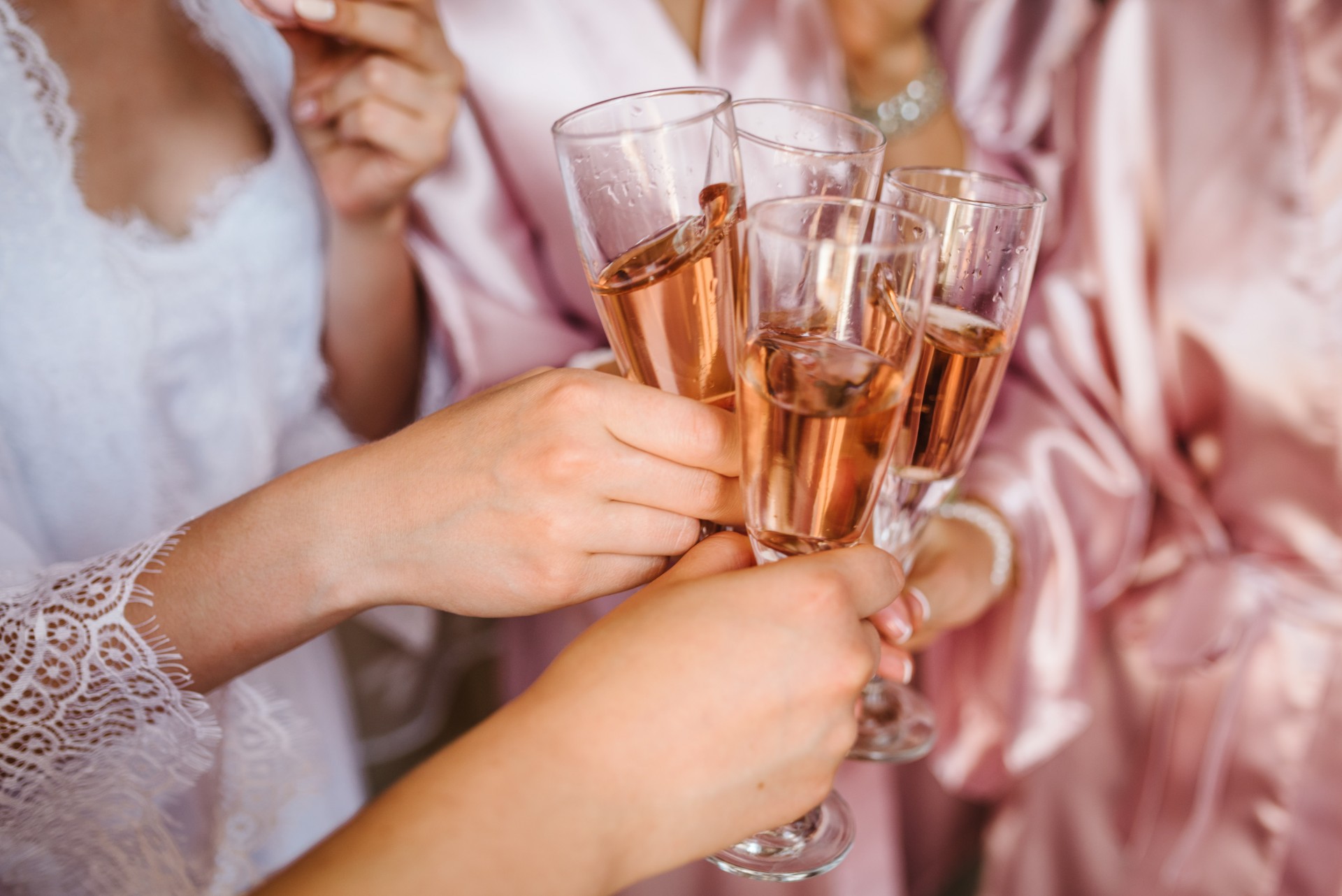 Bridesmaids toasting with Champagne