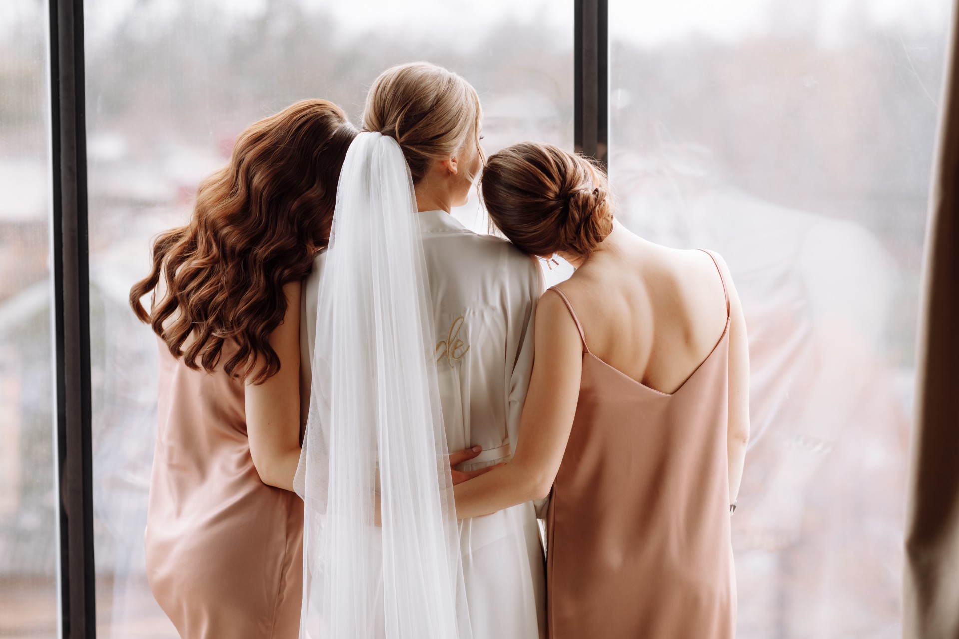 Bridemaids giving bride some emotional support